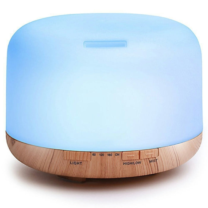 Blue diffuser with wooden base on a white background